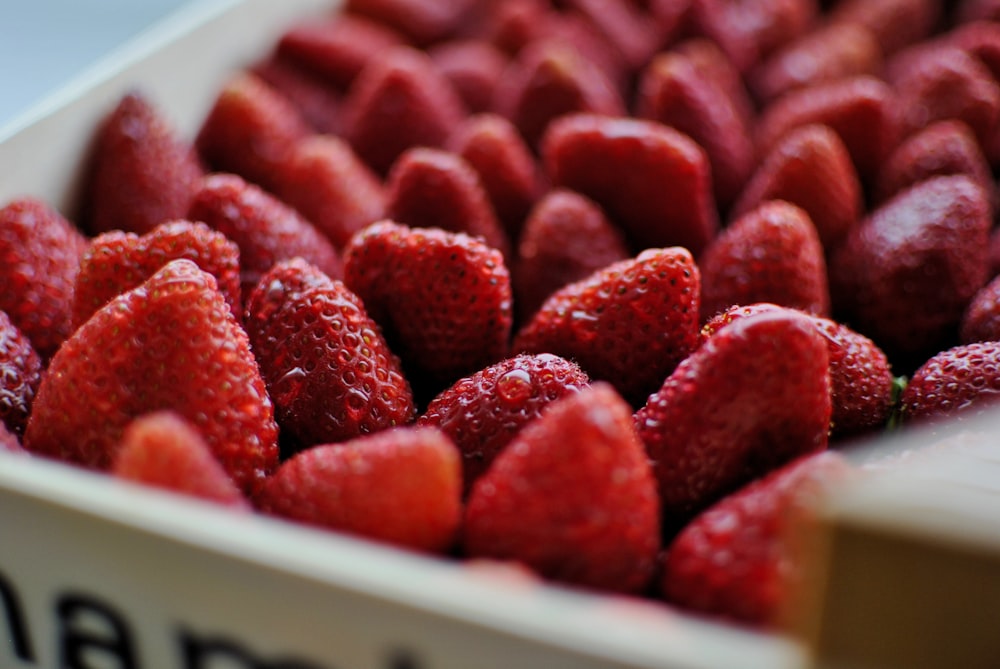 a close up of a box of strawberries