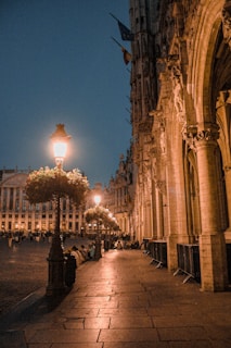 Traveler enjoying a serene moment in a quiet, upscale city square.
