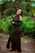 a woman in a black dress posing for a picture