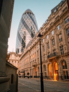 A sleek architectural blueprint overlaying a cityscape of Düsseldorf under soft daylight.