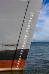the side of a large ship in the water
