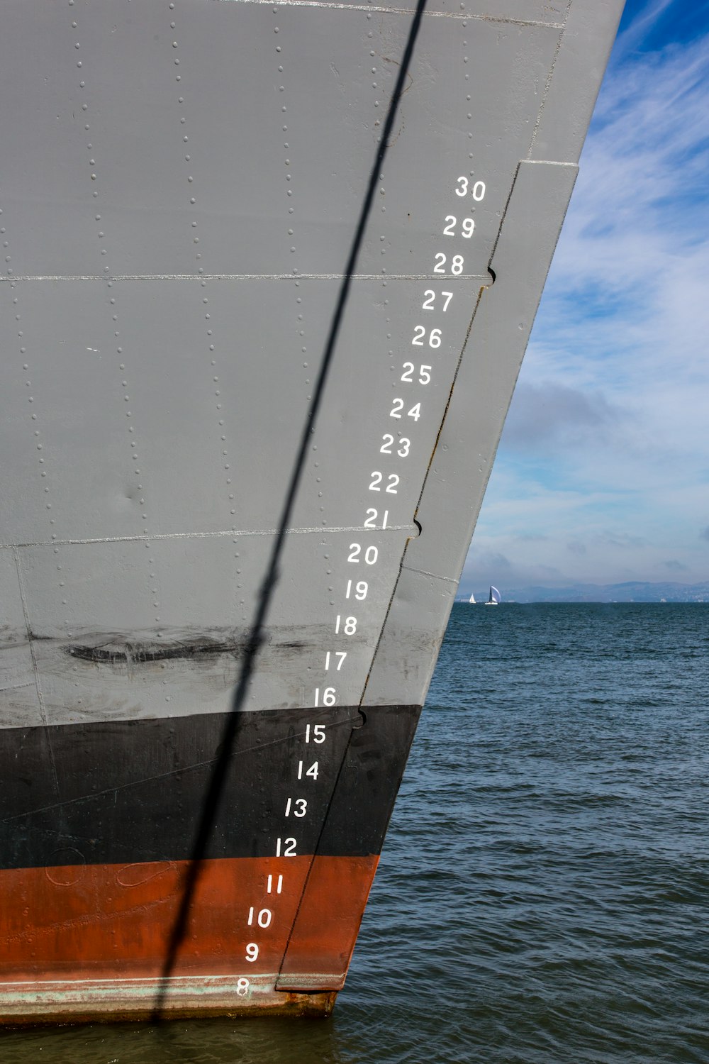 the side of a large ship in the water