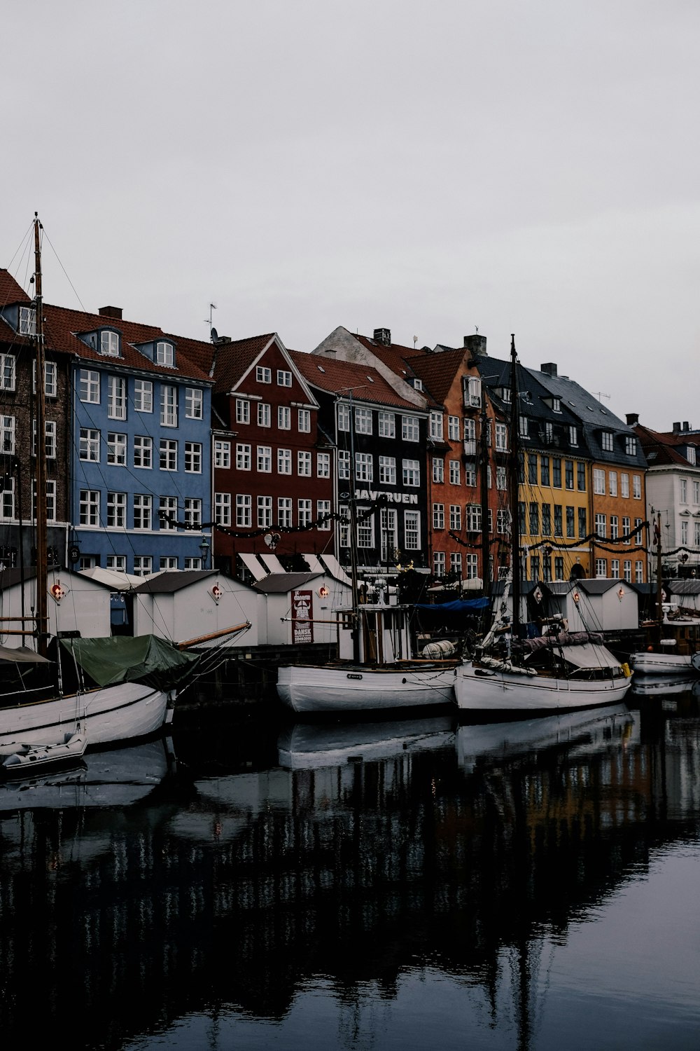 a group of boats that are sitting in the water