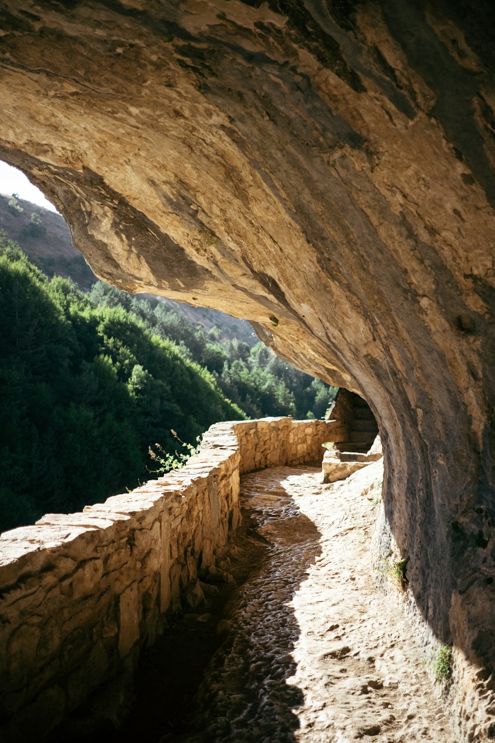 a rock formation with a path going through it