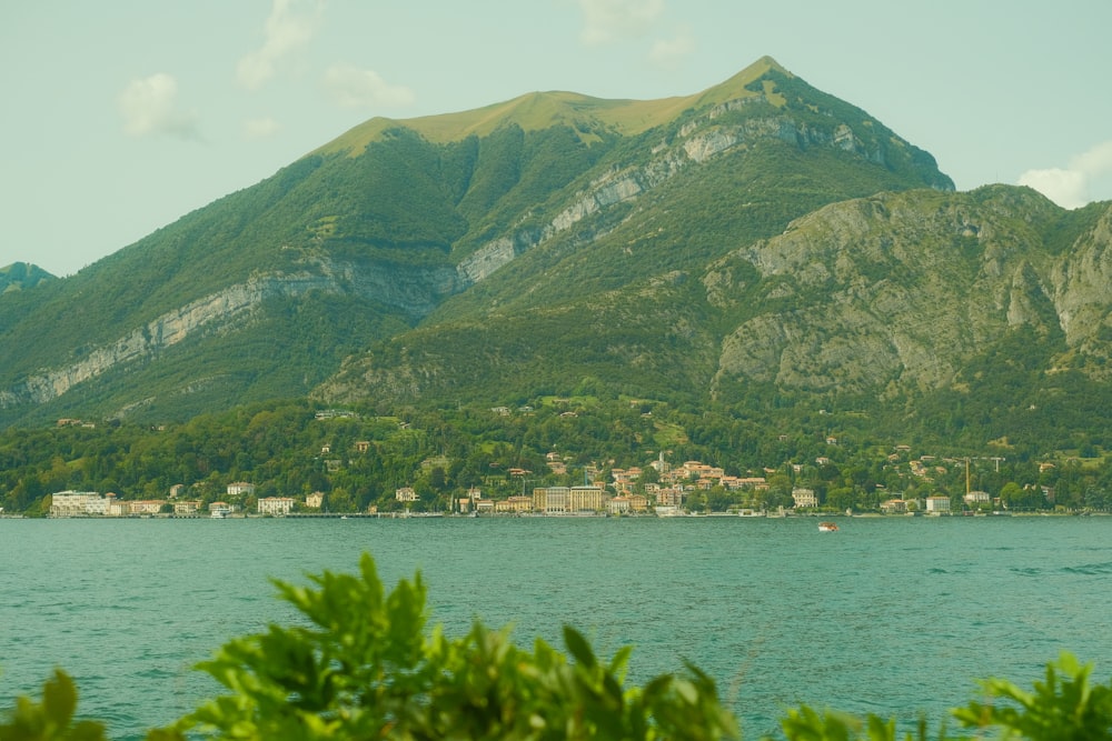 a body of water with a mountain in the background