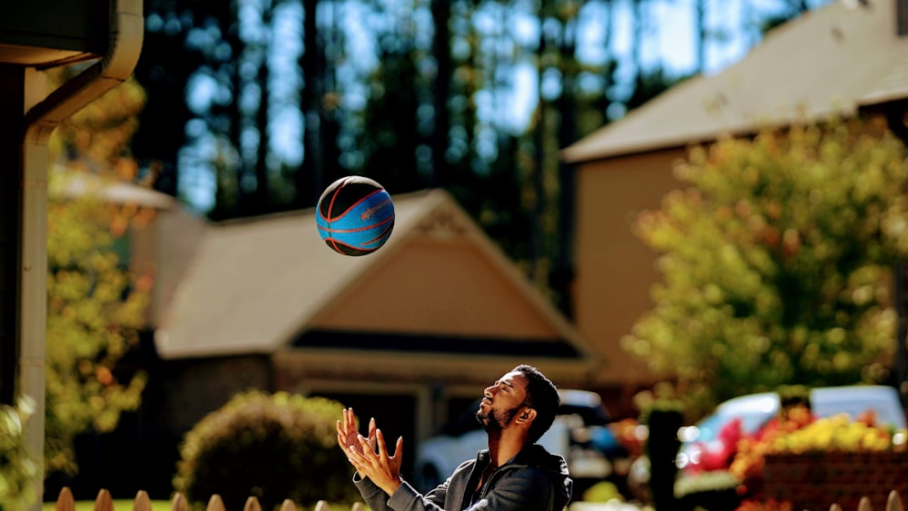 a man is playing with a ball outside