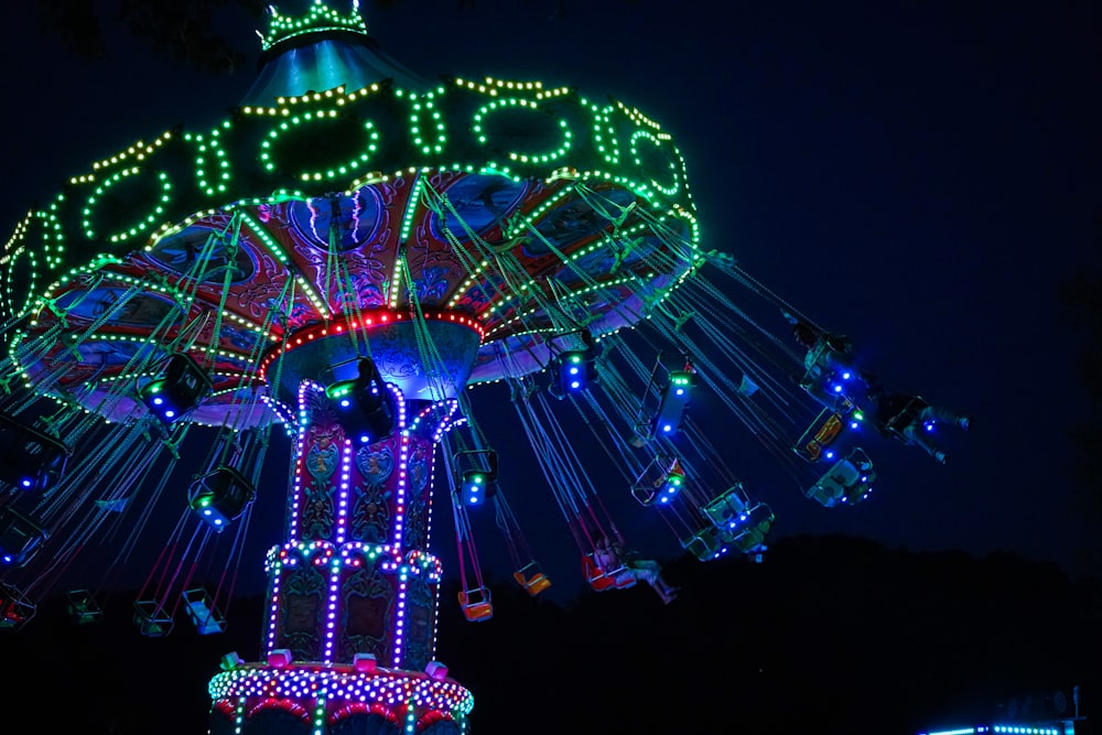 a merry go round lit up at night