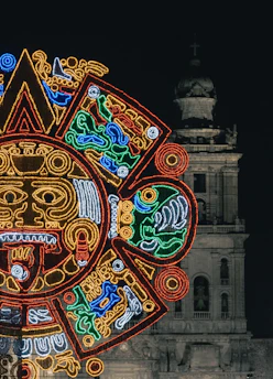 A vibrant Mayan calendar stone with intricate glyphs glowing under soft sunlight.