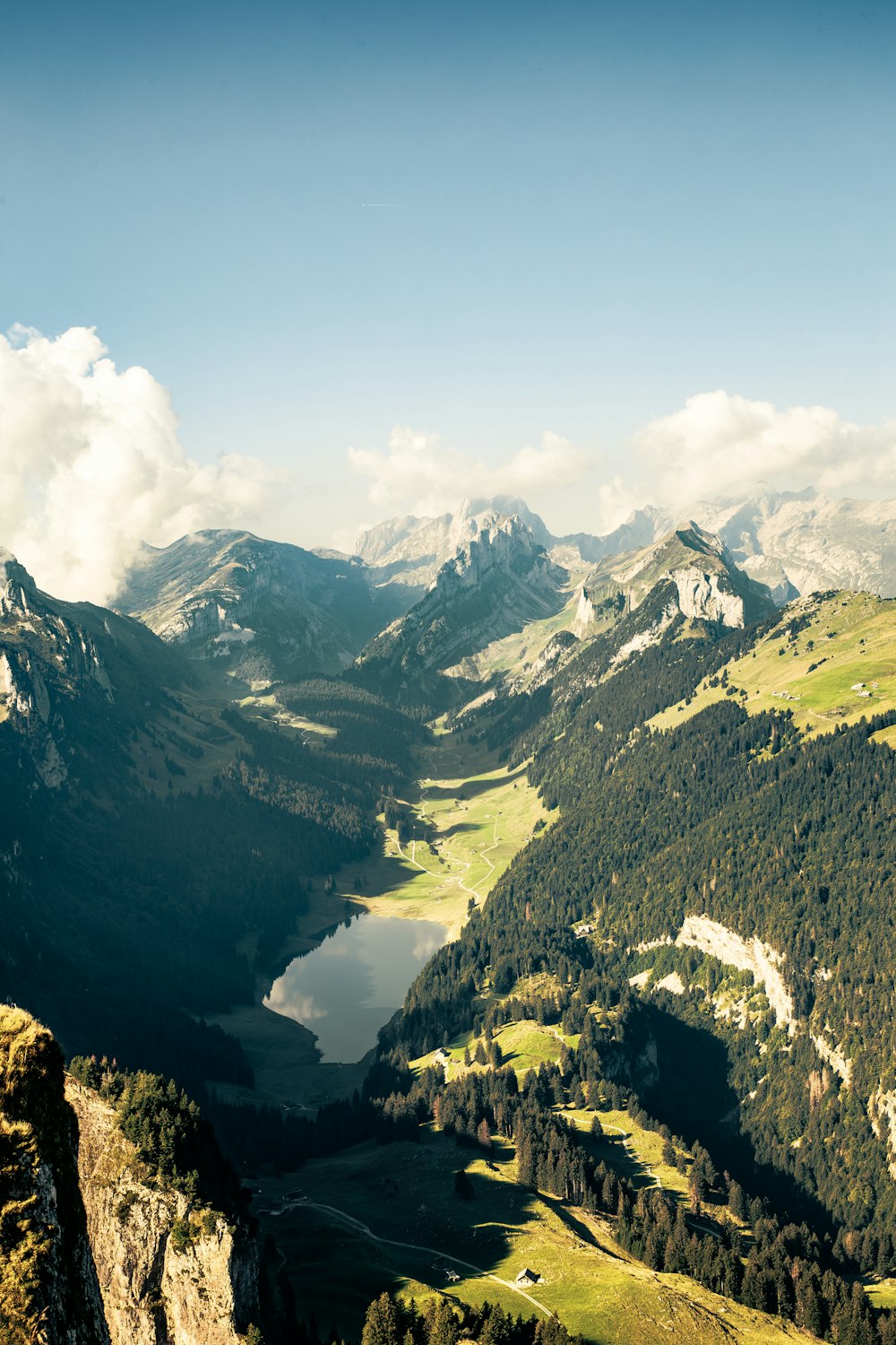 a view of a mountain range with a lake in the middle