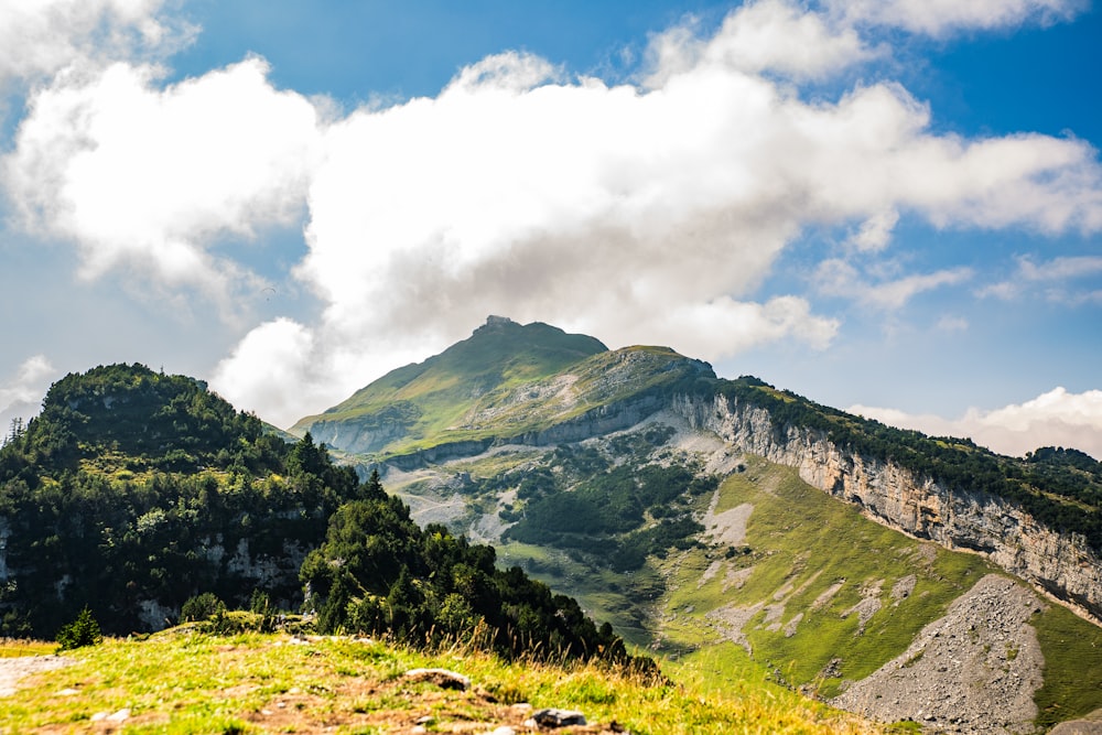 a view of a mountain range with clouds in the sky