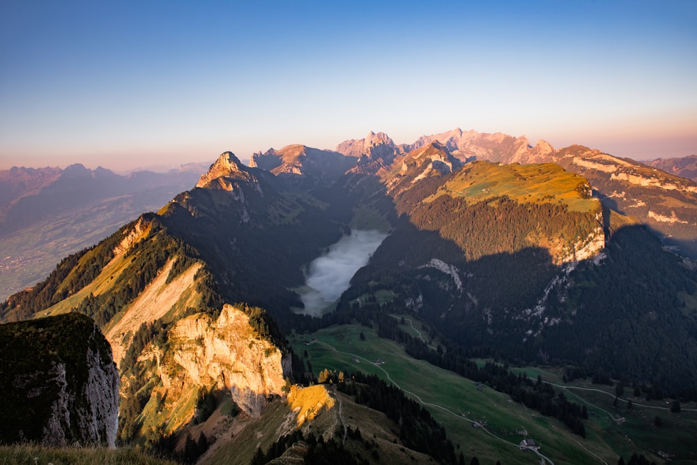 a view of a mountain range at sunset