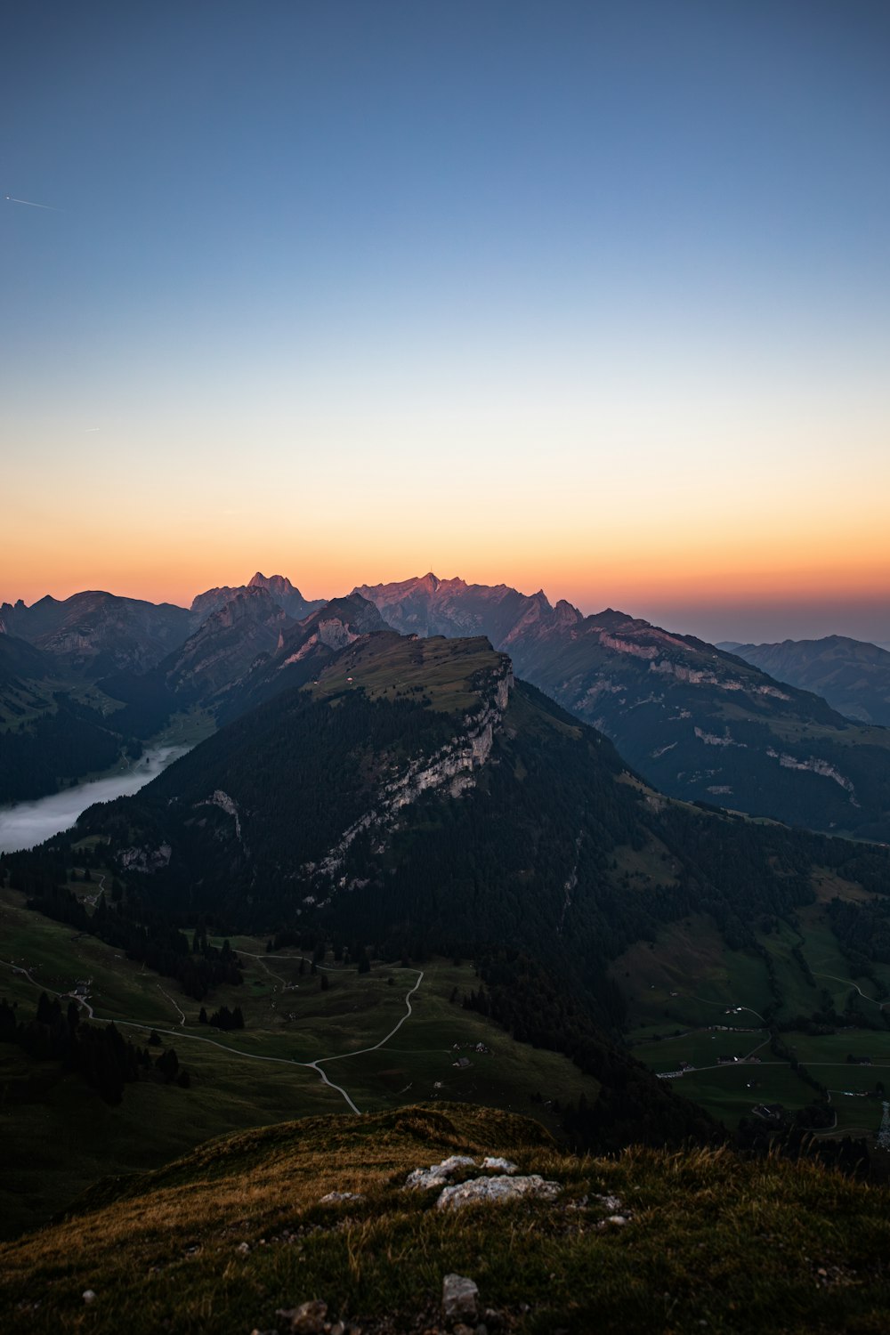 a view of a mountain range at sunset