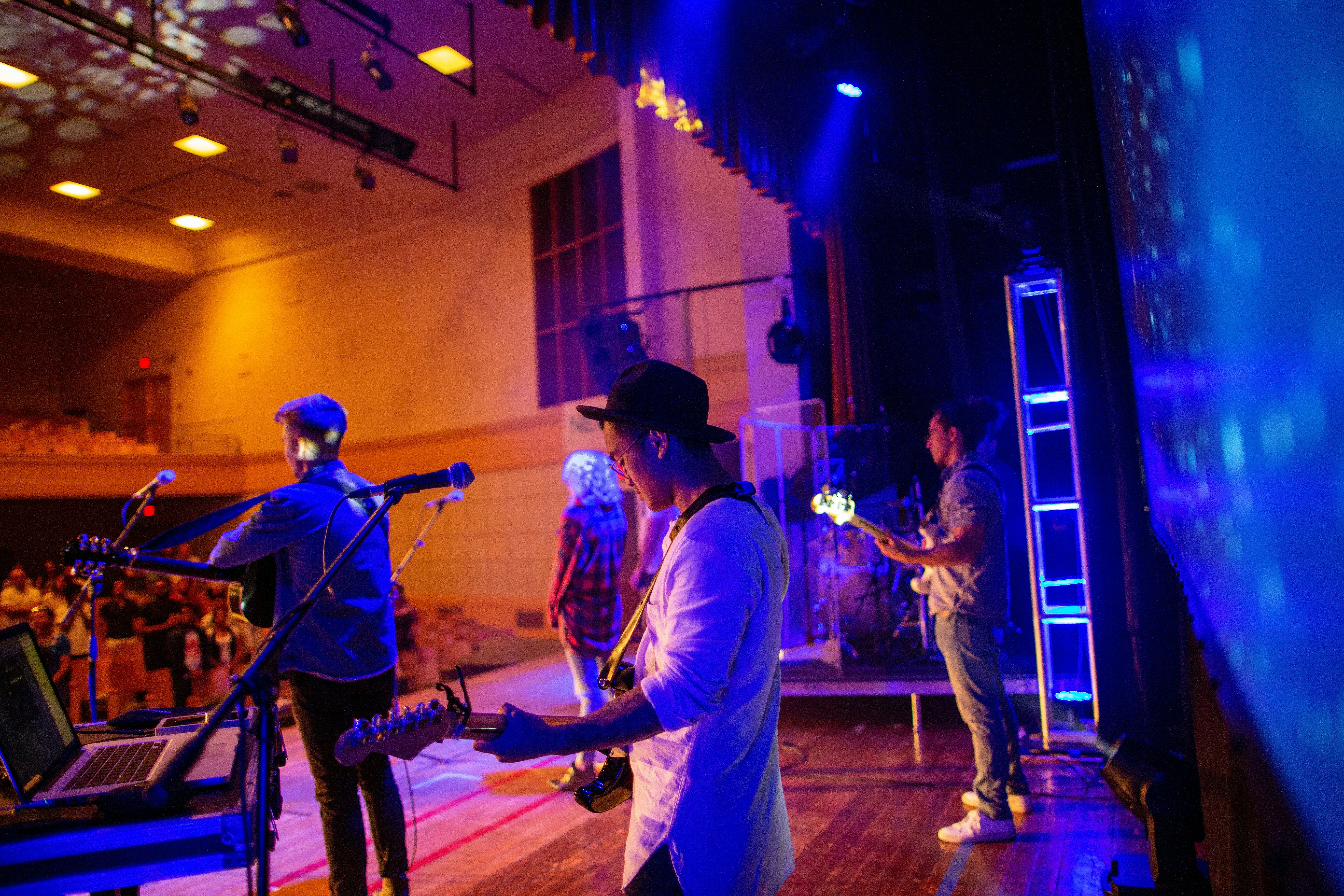 a group of people that are standing in a room