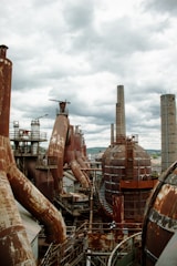 A sprawling sulphur refining plant with heavy machinery under a steel-grey sky.