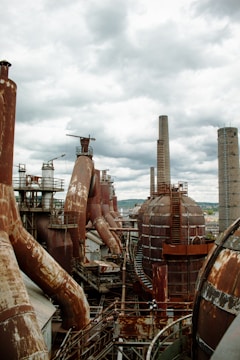 A sprawling sulphur refining plant with heavy machinery under a steel-grey sky.