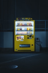 A compact vending machine glowing softly in a modern office corner.