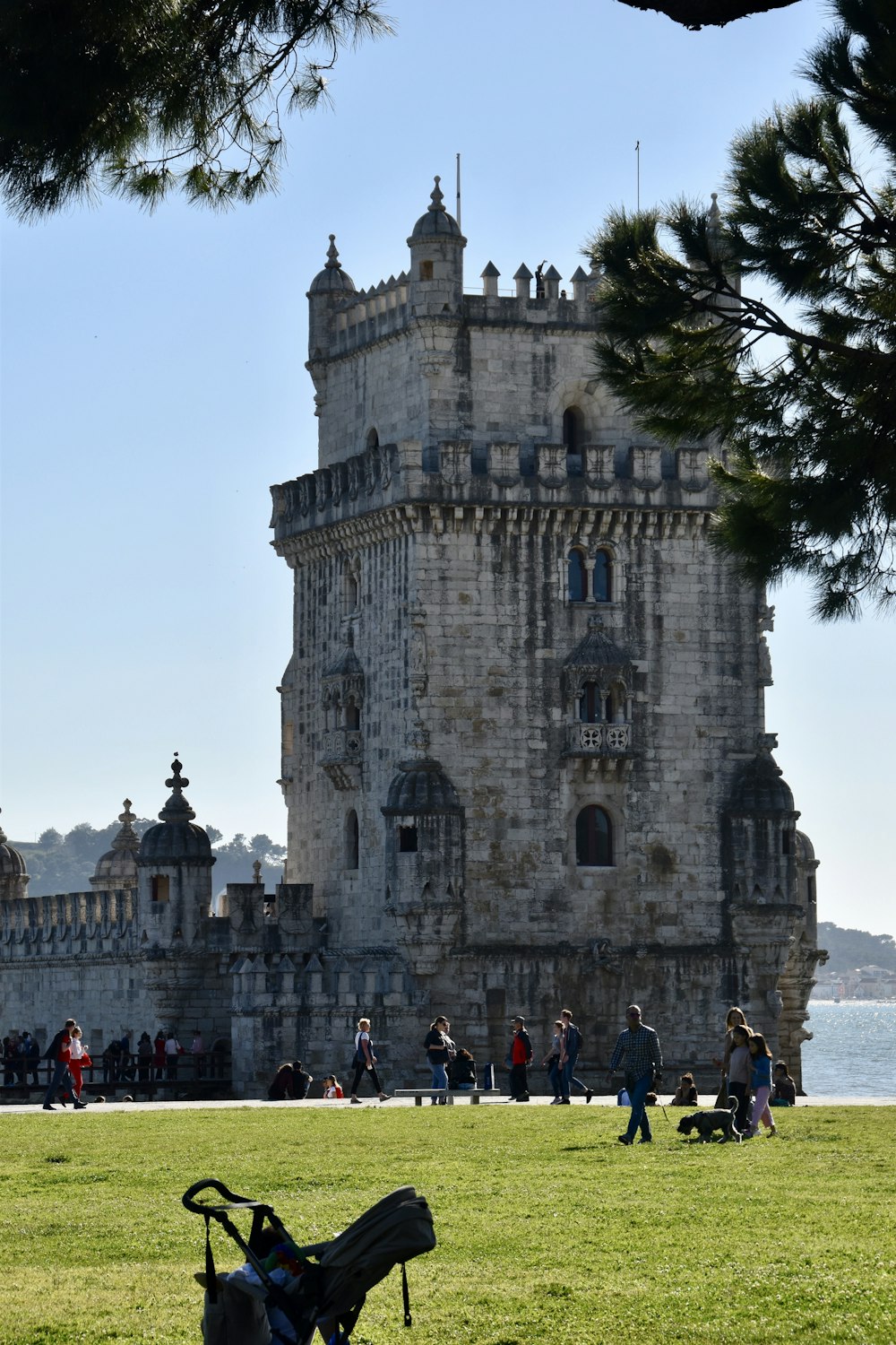 a castle like building with people walking around it