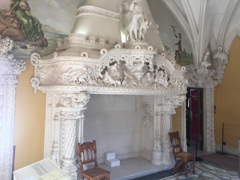Close-up of finely restored wooden details and period fireplace.