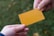 Close-up of hands exchanging business cards during a professional meeting.