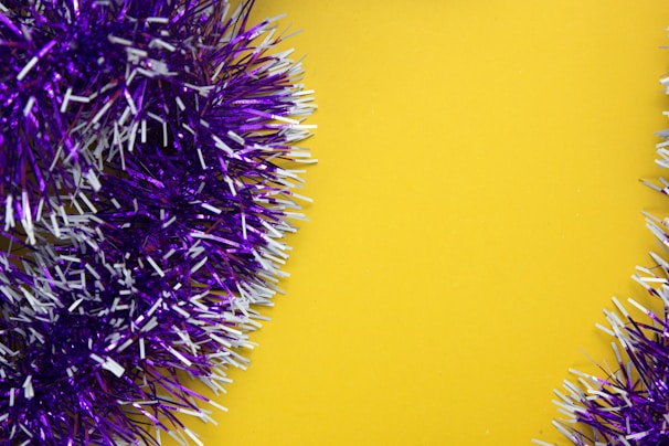 A vibrant display of Tinsel Stump Hawgs hanging against a grey background with yellow highlights.
