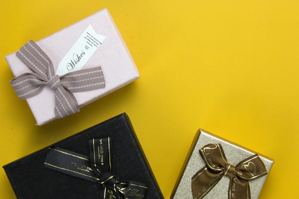 a couple of wrapped presents sitting on top of a table