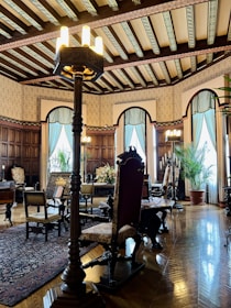 Elegant great room with 15 clerestory windows, antique furnishings, and warm lighting.