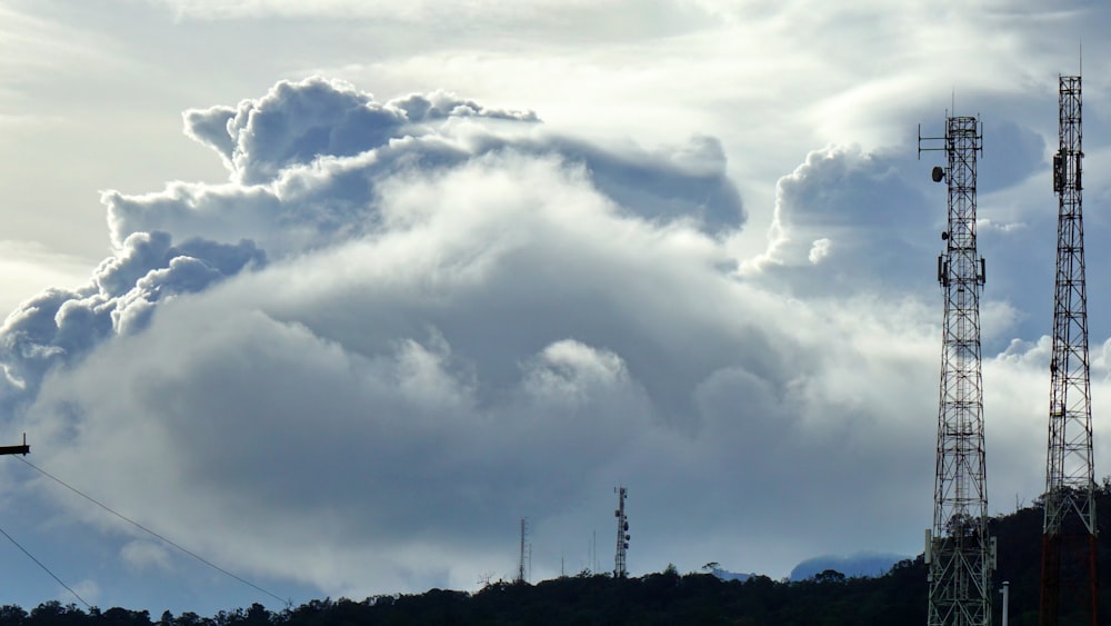 a plane is flying in front of a large cloud