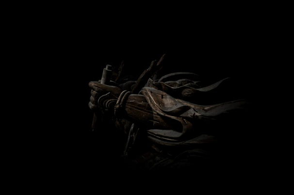 A mysterious medieval armor set with intricate dark designs.