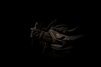 A dark fantasy scene from 'Legends of the Hidden Realm' featuring the hero with intricate Indian-inspired armor standing amidst swirling violet shadows.