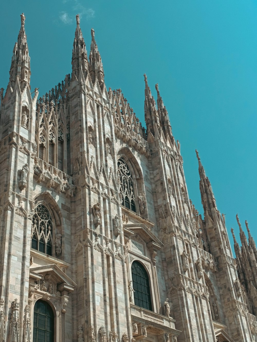 a large cathedral with a clock on the front of it