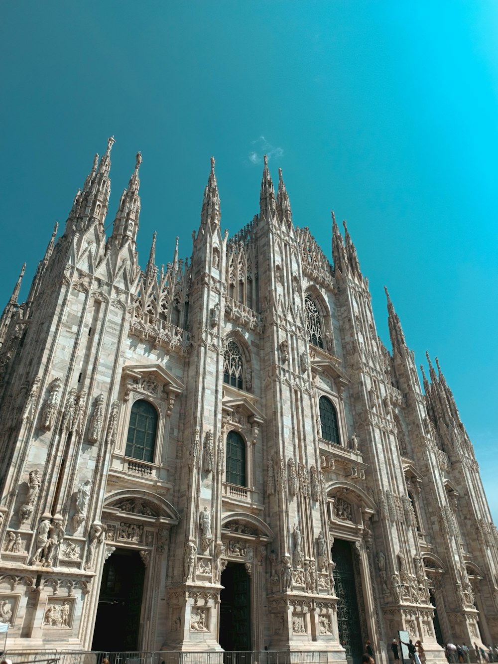 a very tall cathedral with a sky background