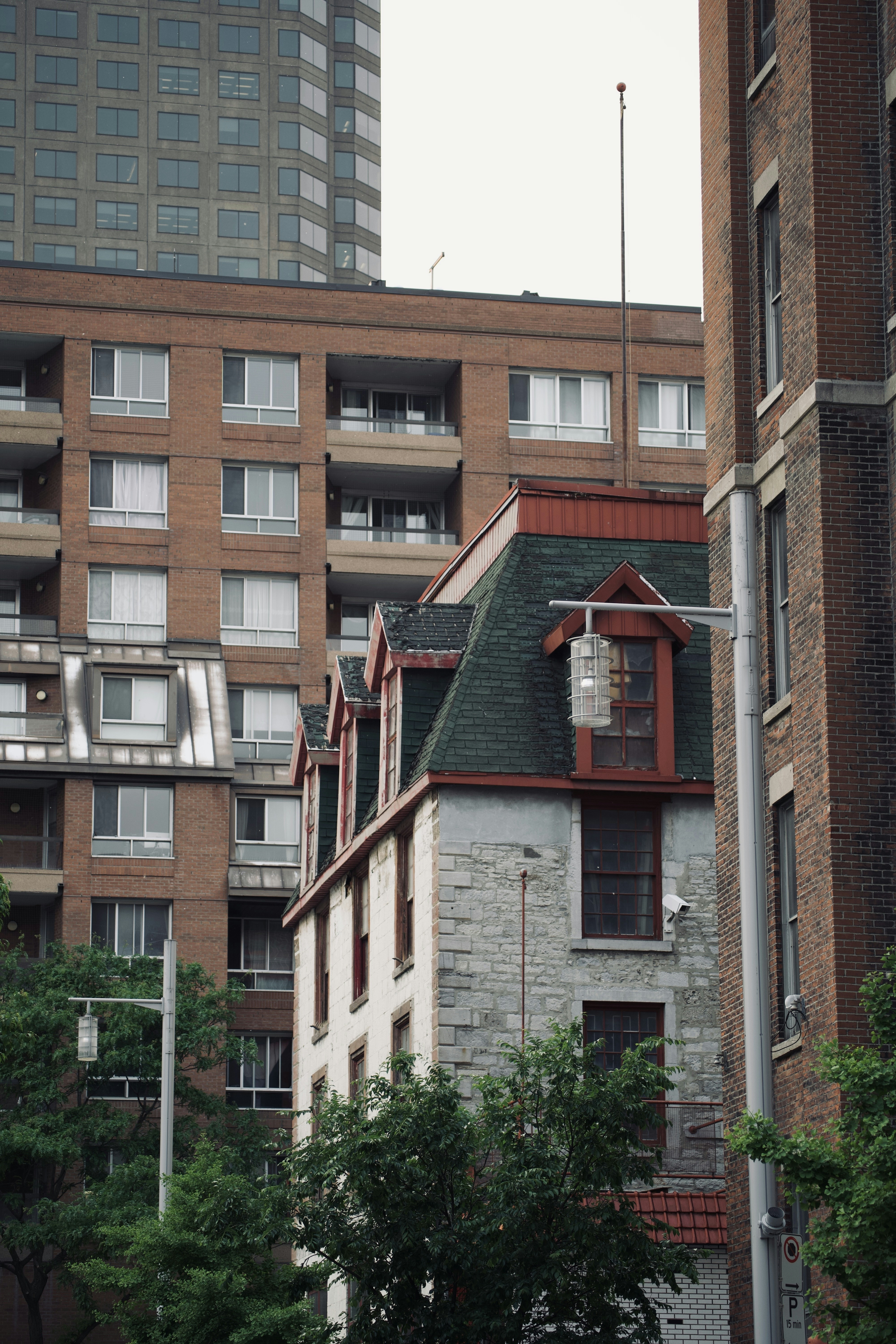 a tall brick building with a clock on the top of it