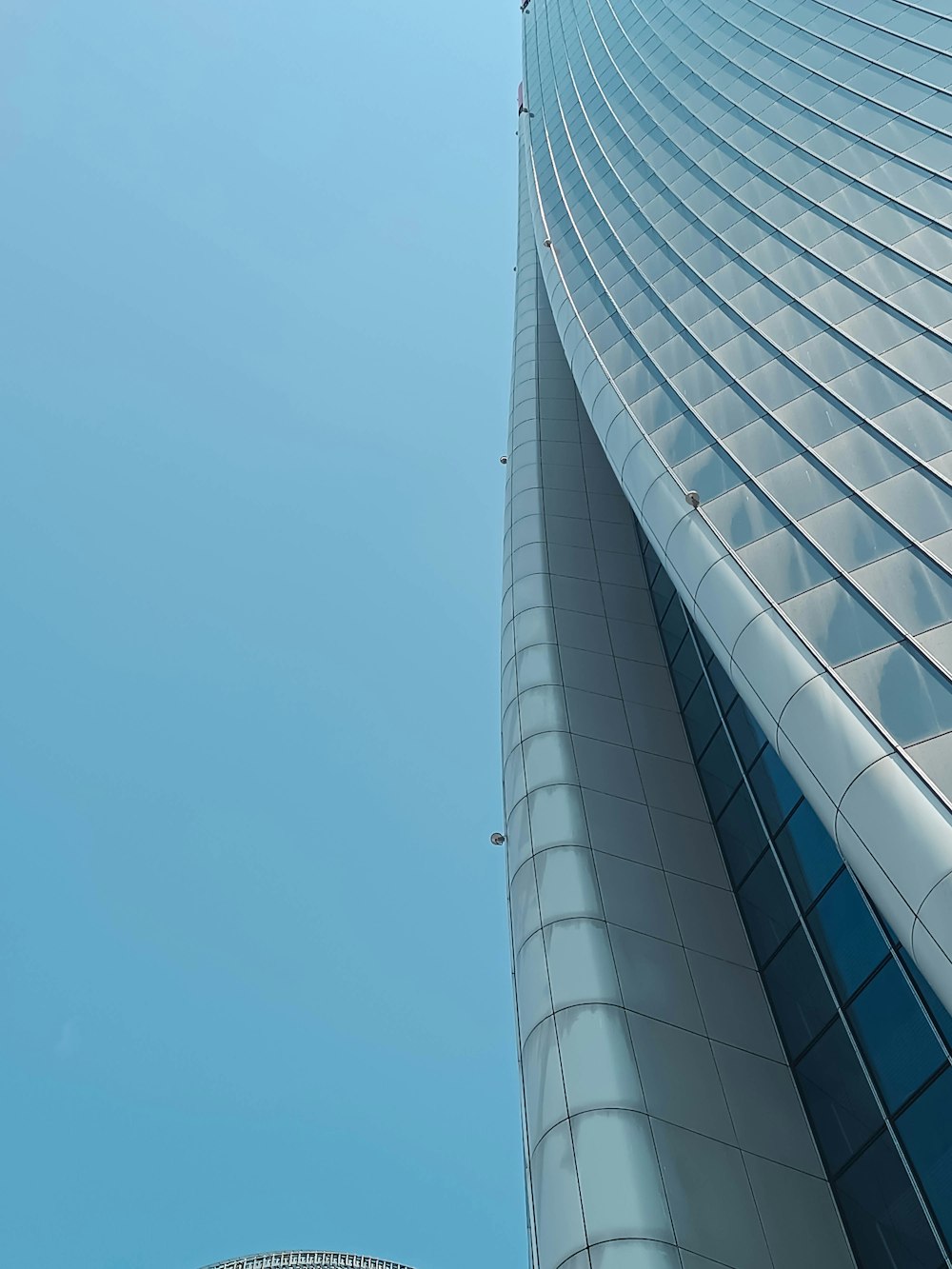 a very tall building with a clock on it's side