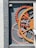 A textured wall features an artistic arrangement of oversized gears, primarily in shades of orange and gray. The gears are embedded in a recess, creating a sense of depth and industrial style. A small, rectangular plaque is visible to the right of the gears.