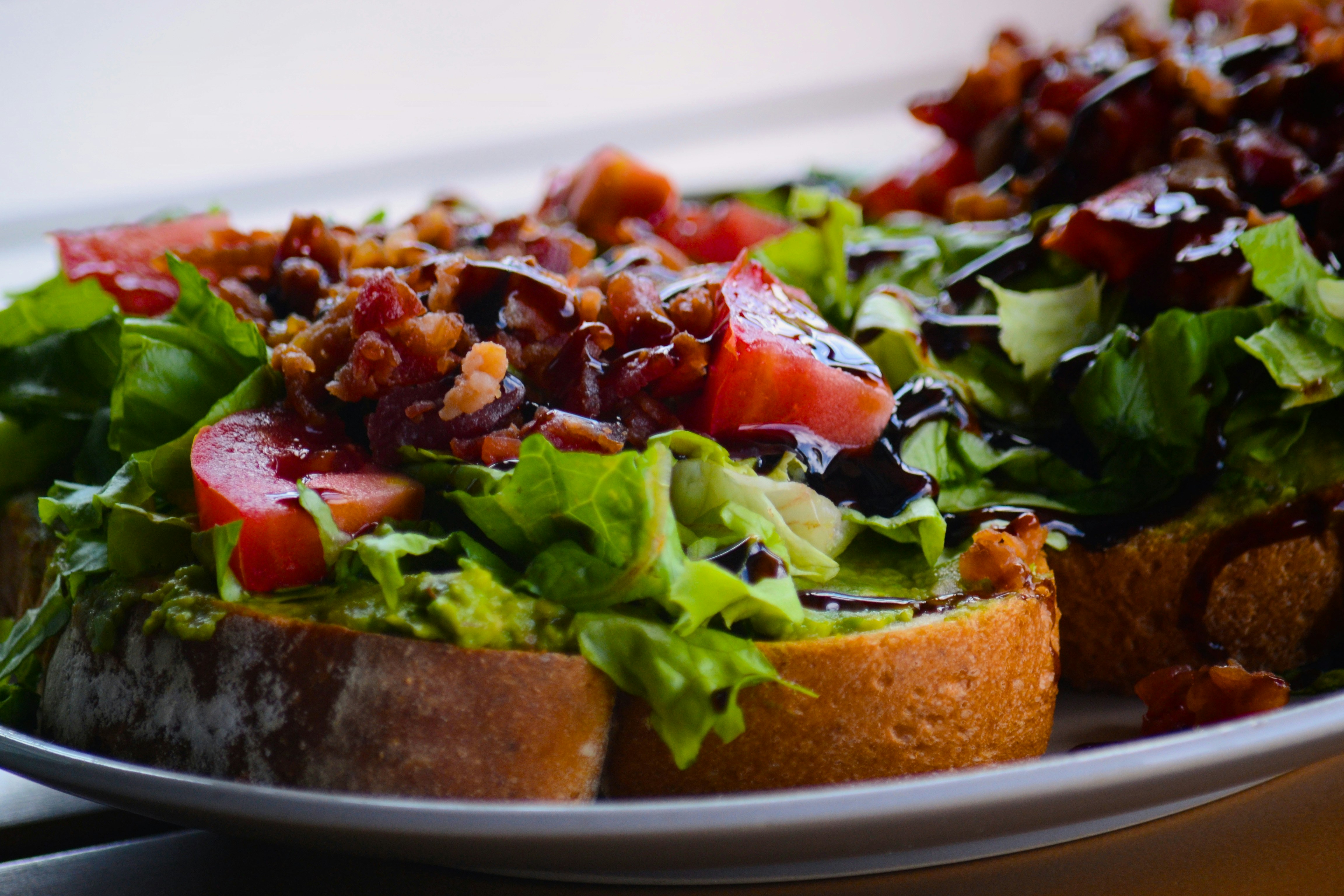 a close up of a plate of food with lettuce