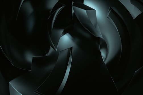 A digital artwork featuring abstract, curved shapes with a glossy finish, rendered in dark tones and illuminated by subtle highlights. The composition suggests depth and movement, with overlapping forms creating a sense of complexity.