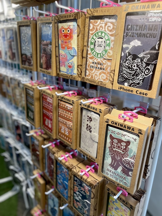 Artistic display of elegant phone cases adorned with soft, spiritual motifs inspired by Calimbó's universe.