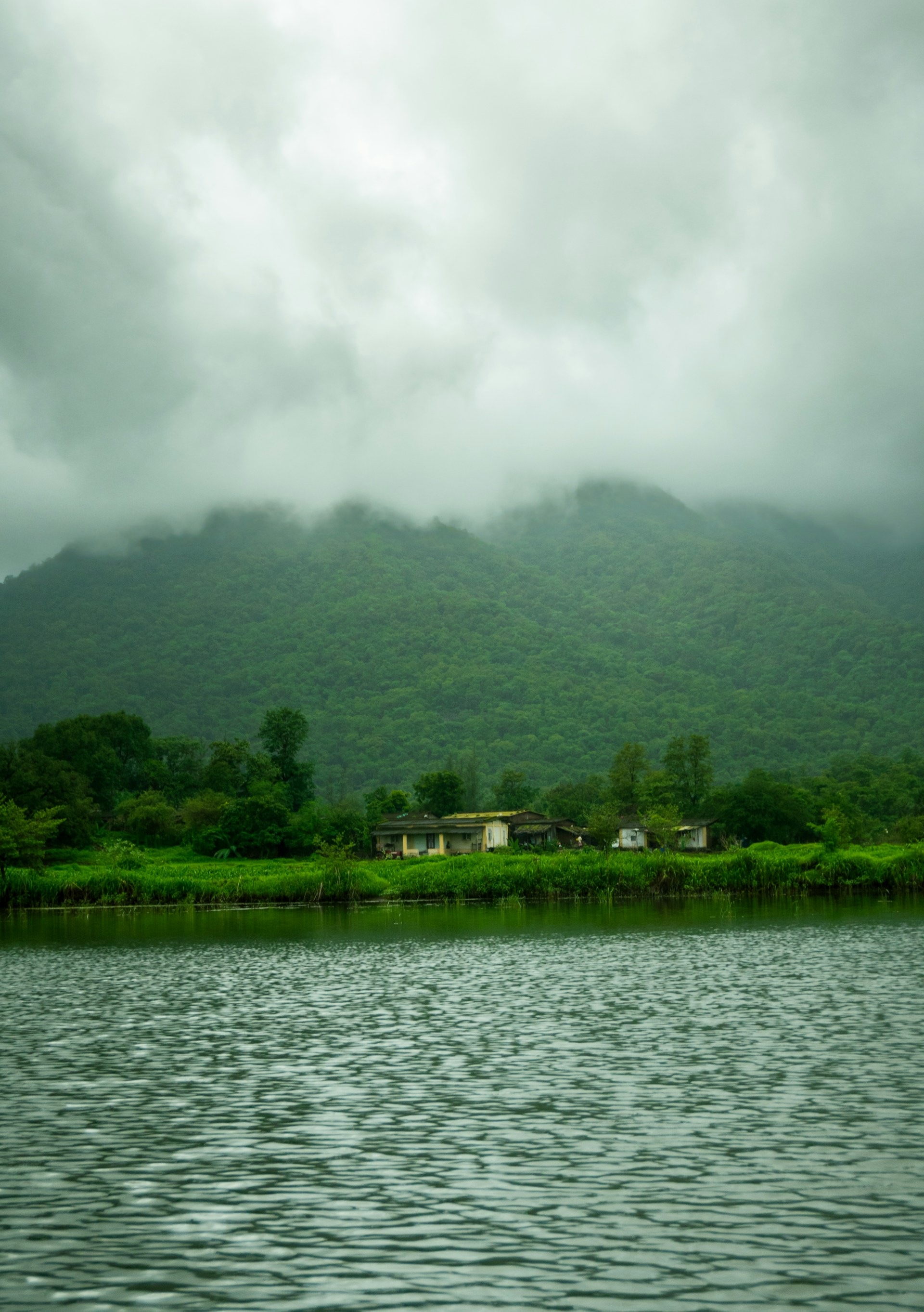 a body of water with a mountain in the background