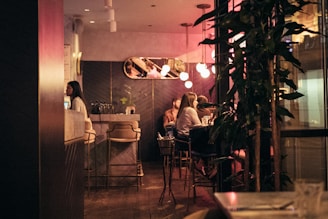 a group of people sitting at a table in a restaurant