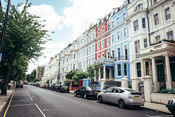 A cozy East England neighborhood with well-kept rental homes on a sunny day.
