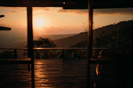 Sunset view over the wooden terraces of Cốm Homestay Bản Giốc.