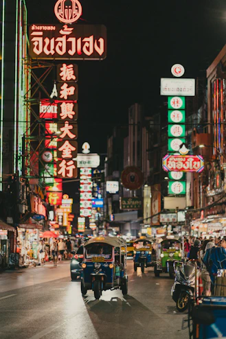 a busy city street filled with lots of neon signs