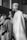 a black and white photo of a priest