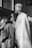 a black and white photo of a priest