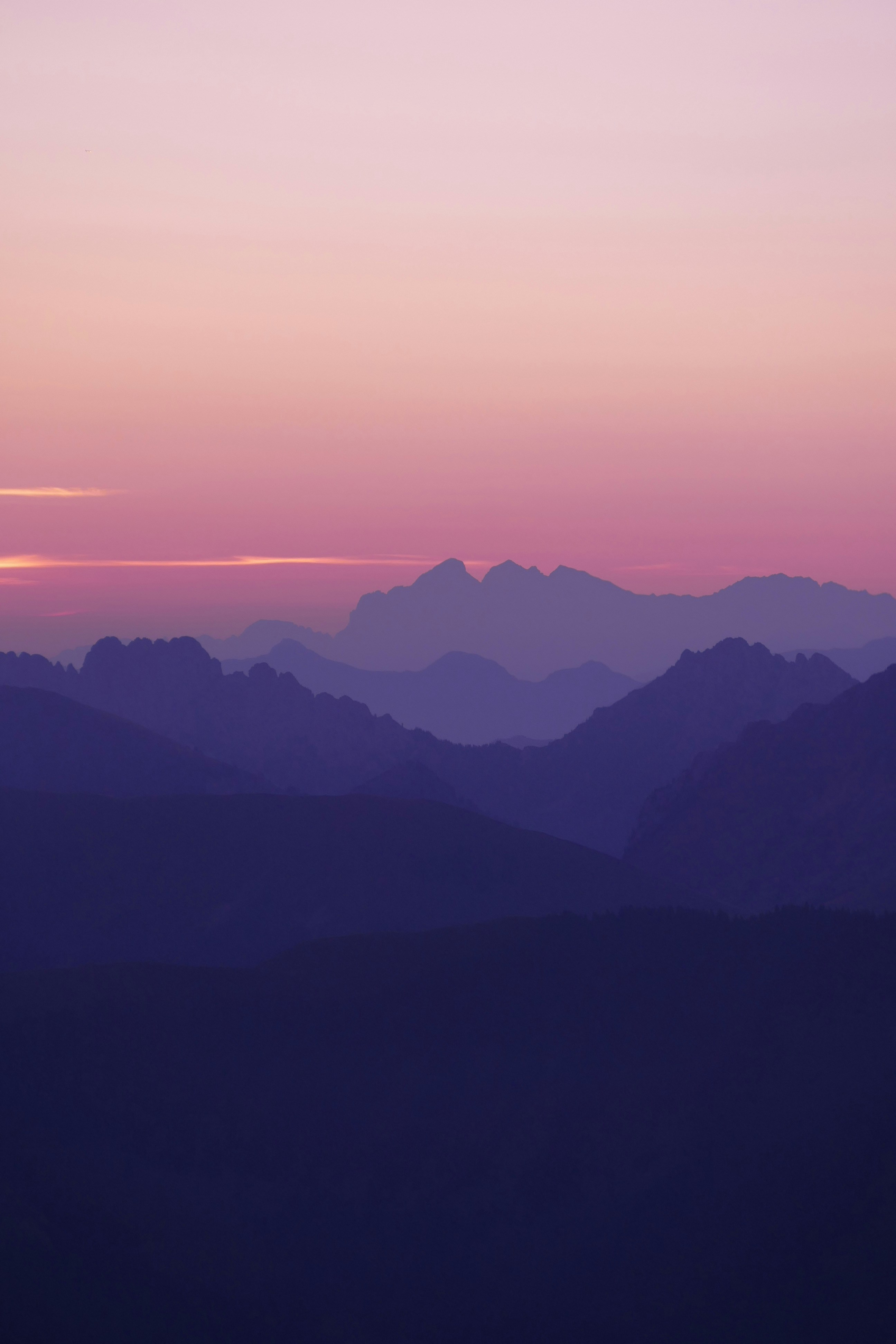a view of a mountain range at sunset