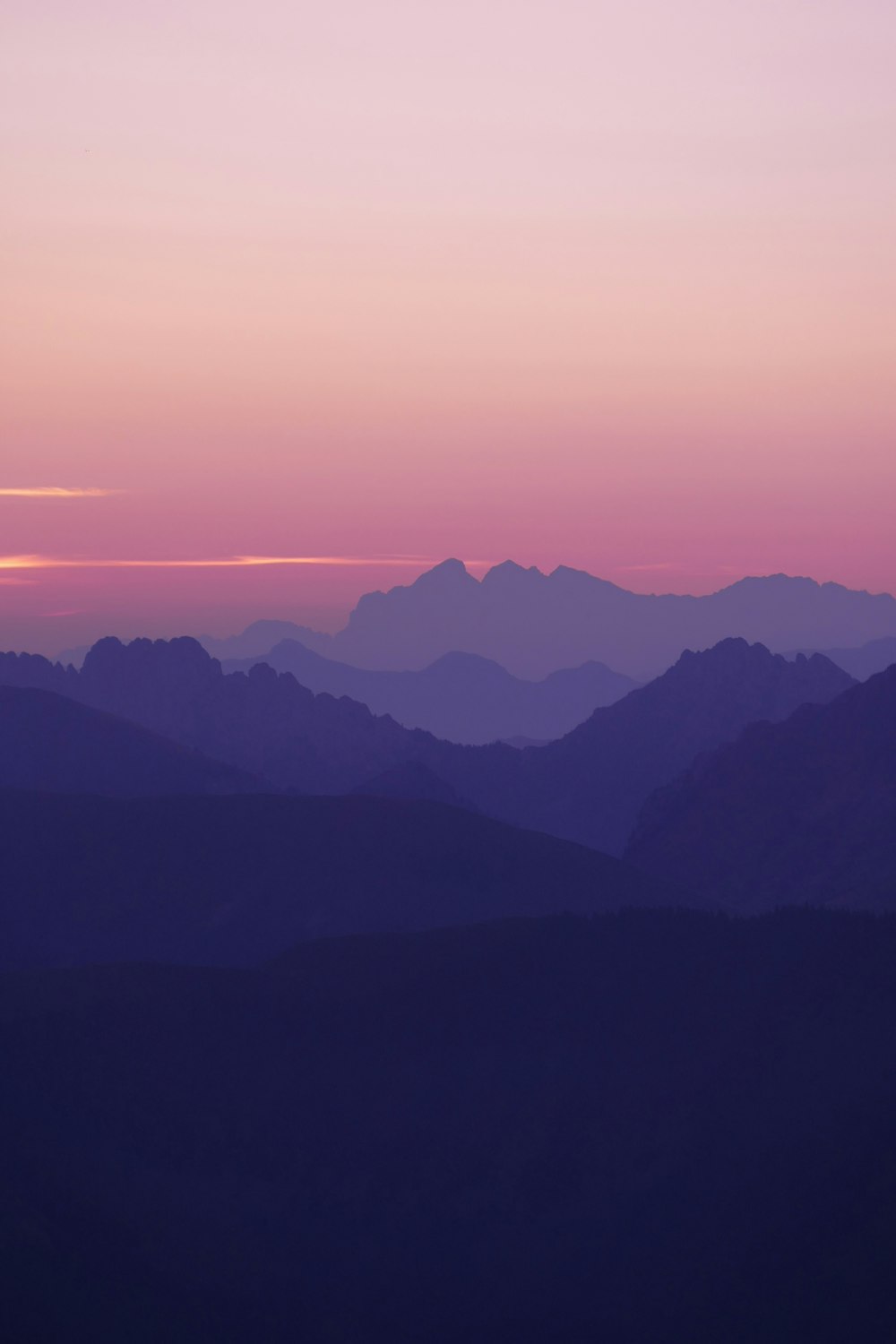 a view of a mountain range at sunset