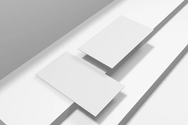 Flat lay of a minimalist black and white invitation suite with clean rectangular crops