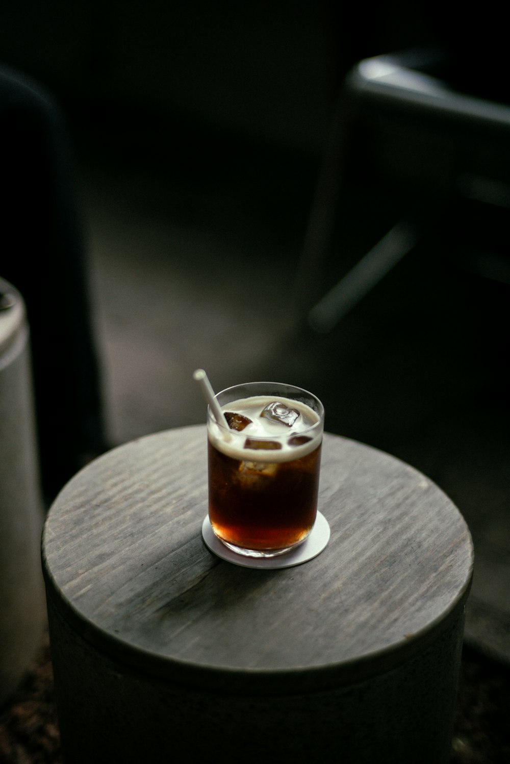 a drink sitting on top of a wooden table