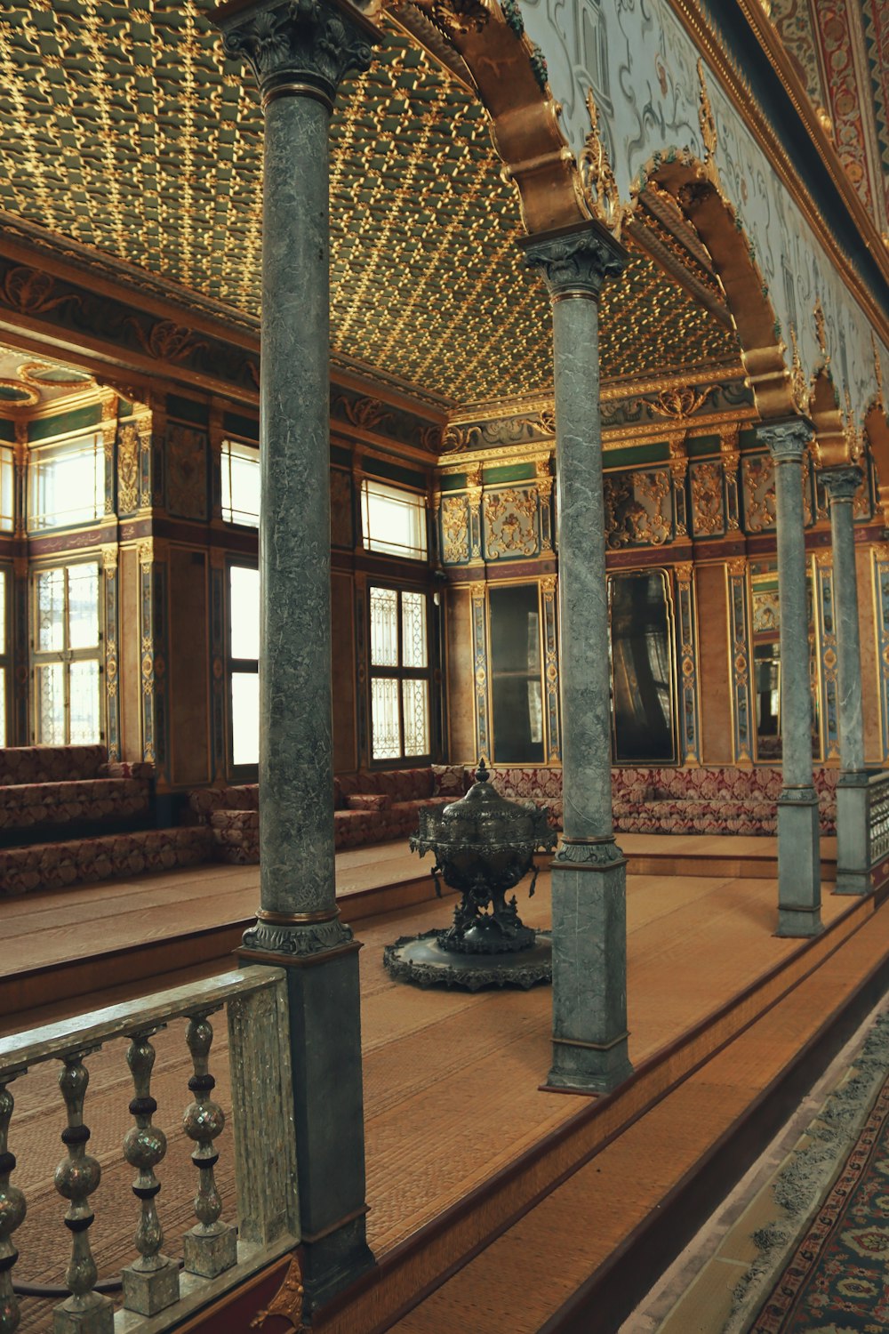 a large room with columns and a couch