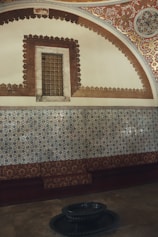 Elegant riad room featuring intricate tile work and a private balcony.